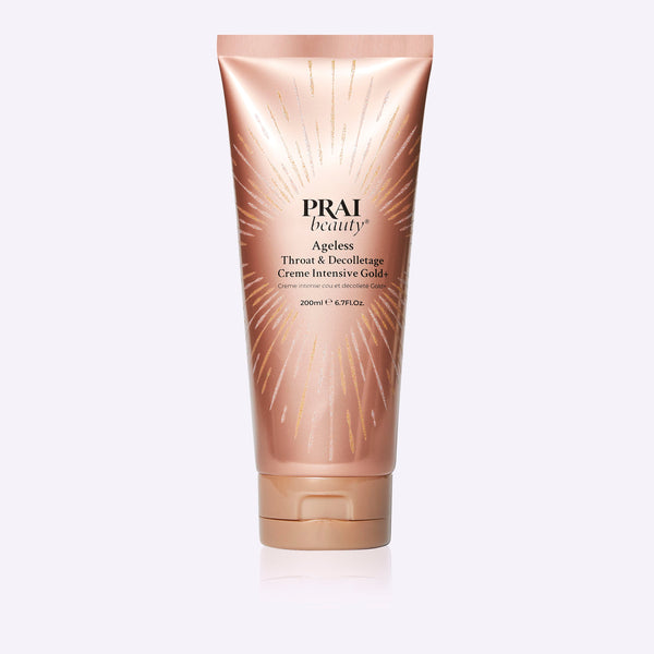 PRAI Beauty Ageless Throat & Decolletage Creme Intensive Gold+ jar resting on a textured travertine surface.