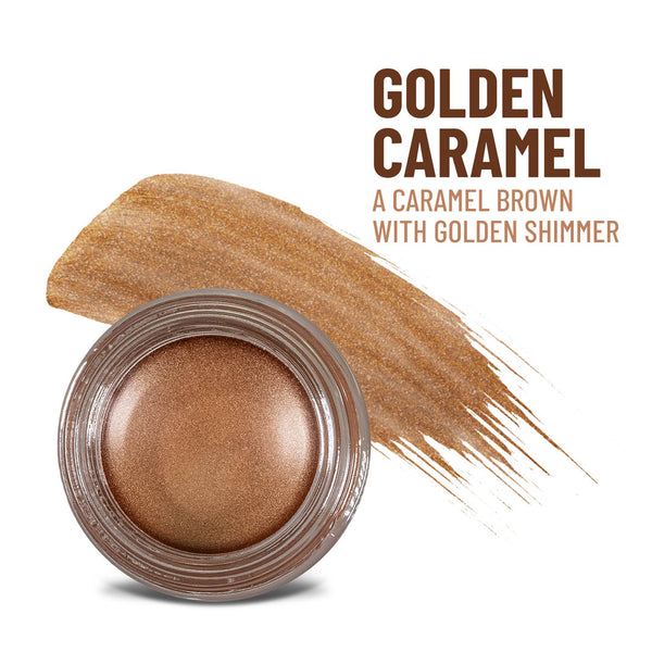 Mommy Makeup Golden Caramel Any Wear Creme in a sleek compact, displayed on a textured travertine surface.