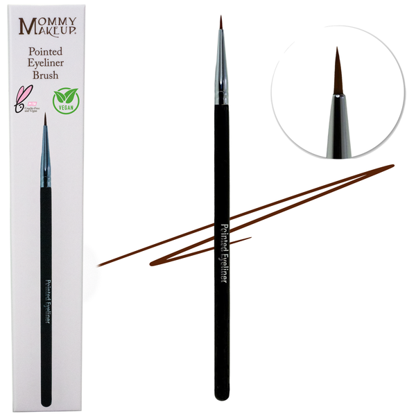 Mommy Makeup Pointed Eyeliner Brush with a sleek black handle resting on a textured oatmeal linen background.