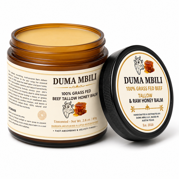 Duma Mbili 100% Grass-Fed Tallow & Honey Balm in a minimalist glass apothecary jar resting on a textured travertine plinth.