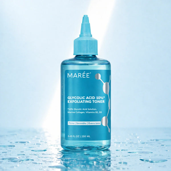 Marée Glow Boost Glycolic Face Toner in a sleek, minimalist frosted glass bottle placed on a beige travertine surface.