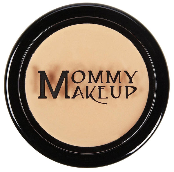 Mommy Makeup Mommy's Little Helper concealer pot in Sleeping Beauty shade resting on a minimalist travertine stone.