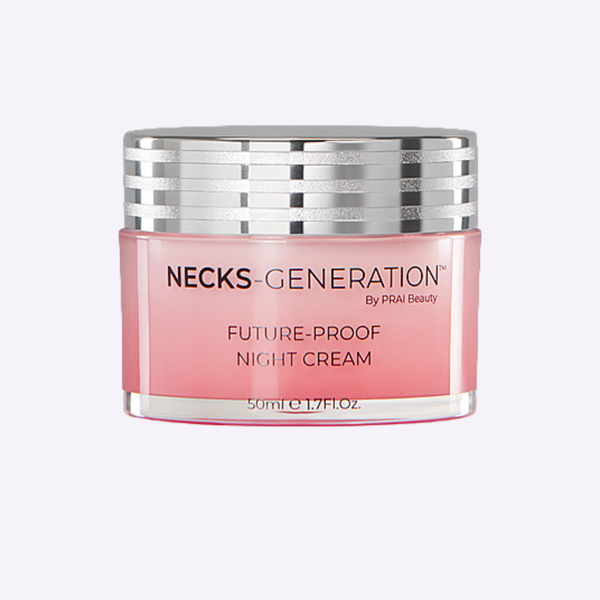PRAI Beauty Necks-Generation Future-Proof Night Cream in a sleek, weighted glass jar resting on a textured stone surface.