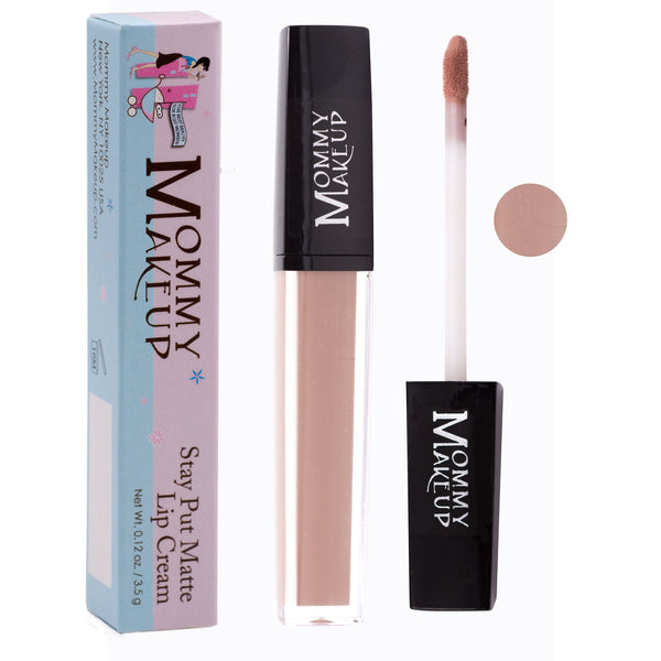 Mommy Makeup Twiggy Stay Put Matte Lip Cream in a sleek, minimalist container resting on a textured travertine surface.