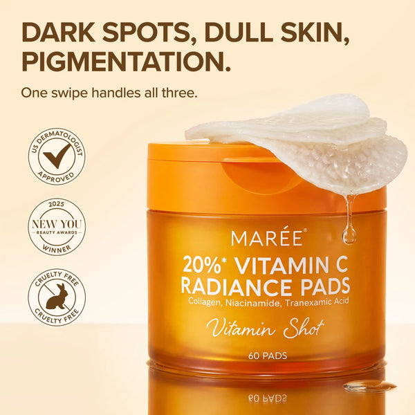 Marée Dark Spot Fading Vitamin C Pads in a minimalist white jar, set against a warm, textured travertine surface.