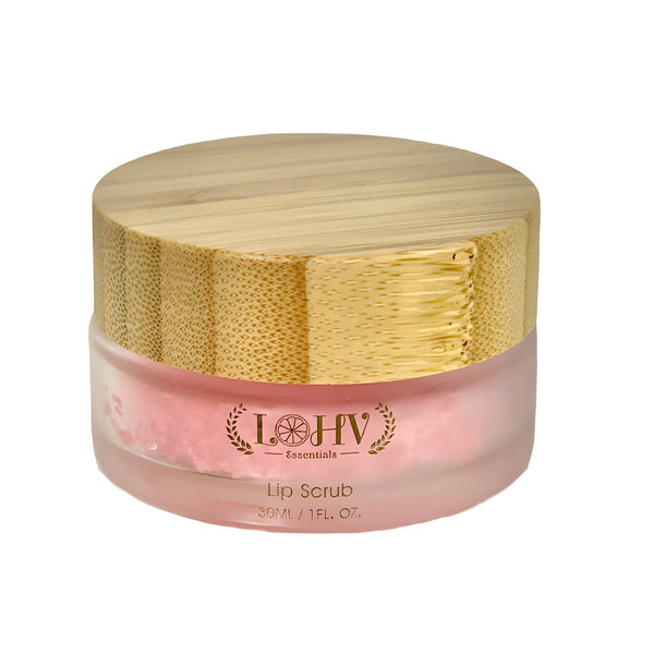 LOHV ESSENTIALS Strawberry Nourishing Lip Scrub in a minimalist frosted glass jar resting on a textured travertine surface.