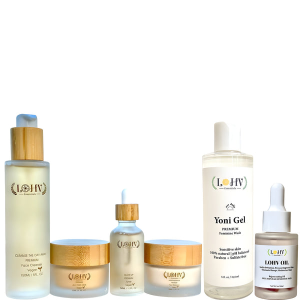LOHV ESSENTIALS Ultimate Glow Complete Skincare Bundle arranged on a minimalist travertine stone plinth.